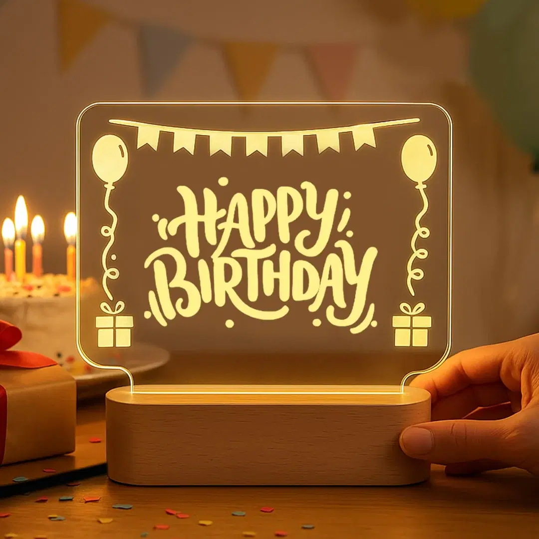 Happy Birthday LED acrylic lamp on a celebration table