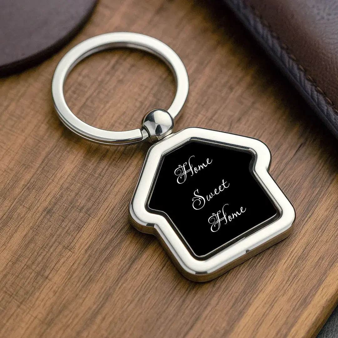 Personalized house-shaped metal keychain close-up