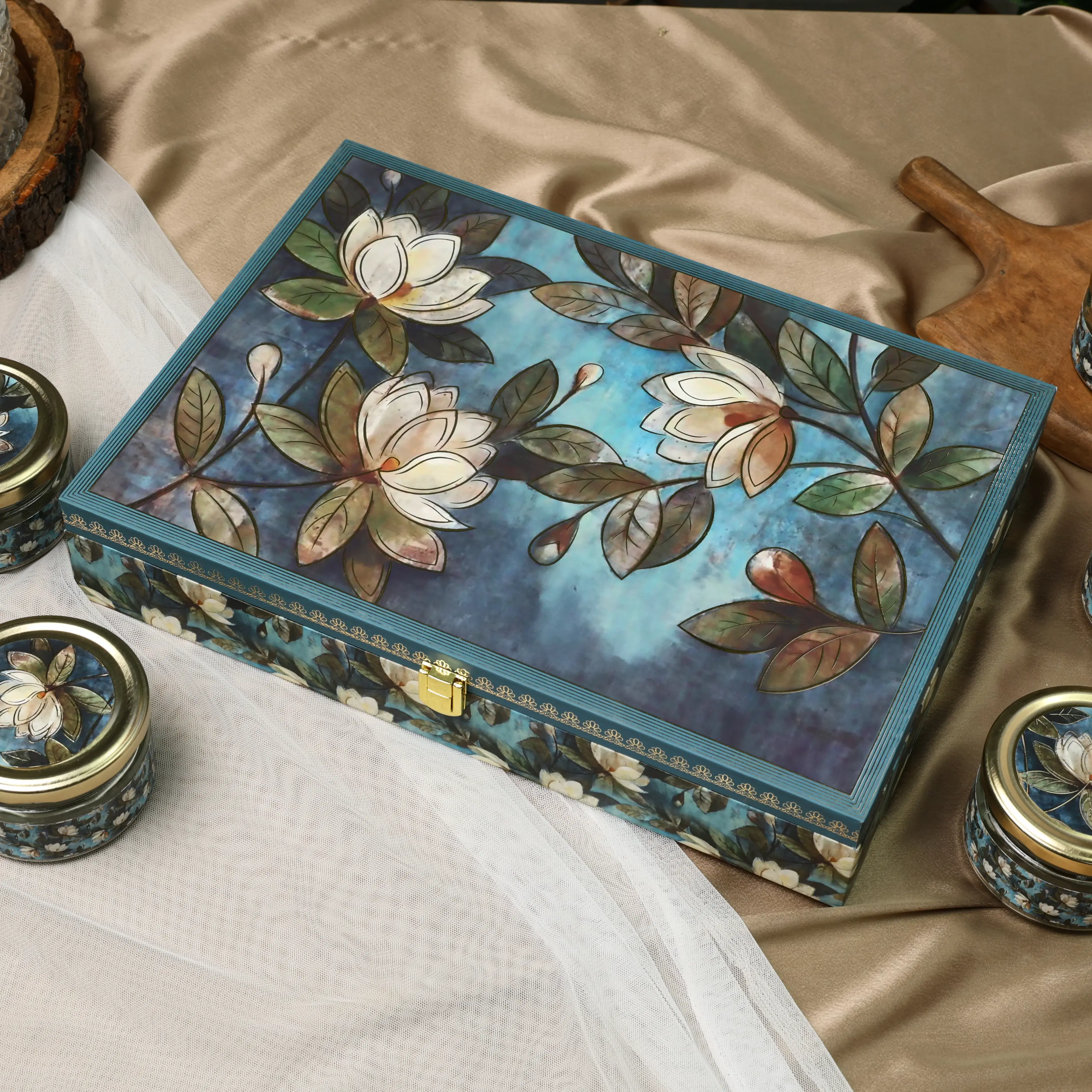 Closed floral dry fruit gift box with blue floral artwork
